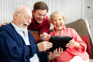 Family Uses Tablet PC and Laughs